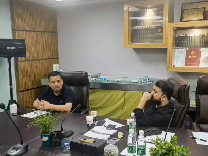 Xu Lei and MD. Nazmul Hossain discussing in the meeting room.jpg